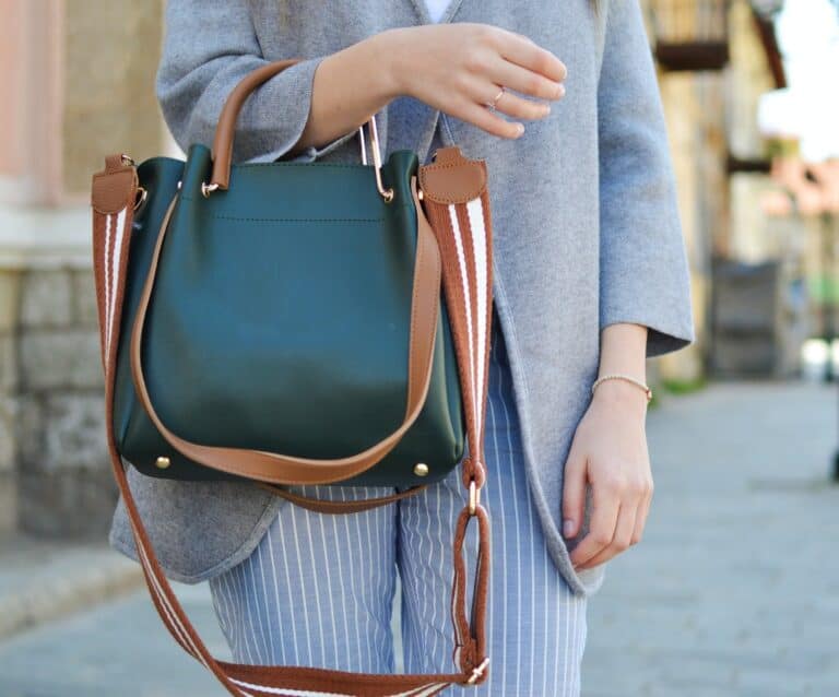 A person holding a bag of luggage