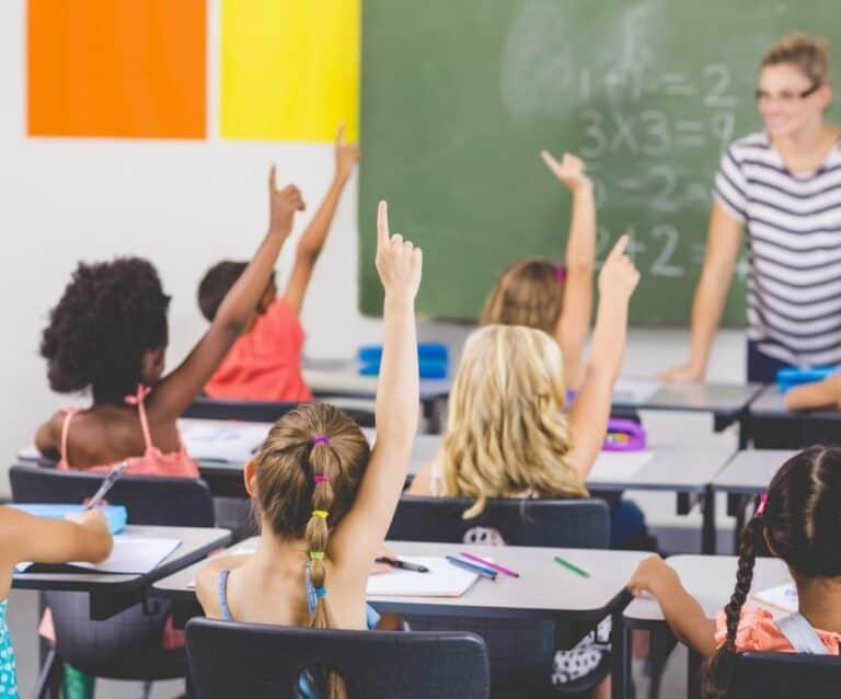 A group of children sitting at school desks