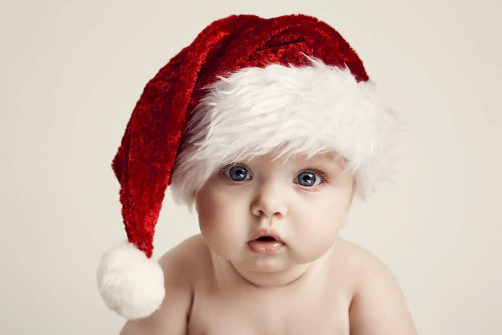Children's ISA - baby wearing a Santa hat