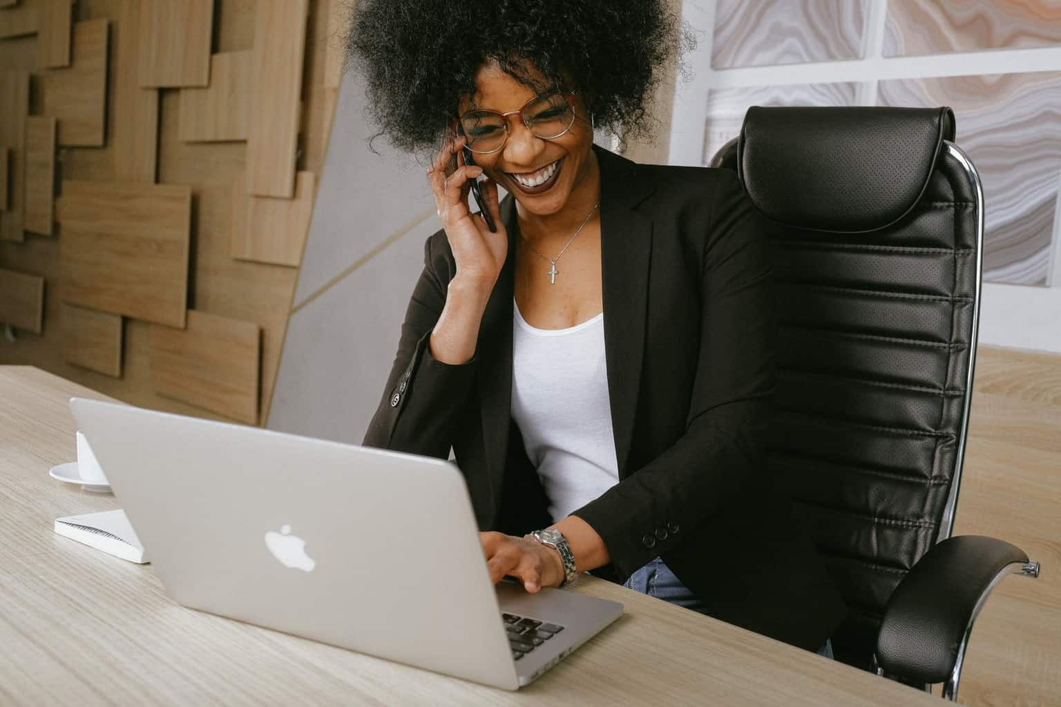 4 Ways To Grow Your Business In 2022 | woman in black blazer sitting on black office chair