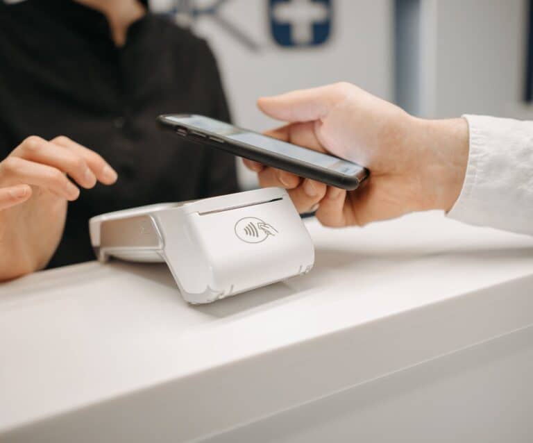 a person making payment using smartphone