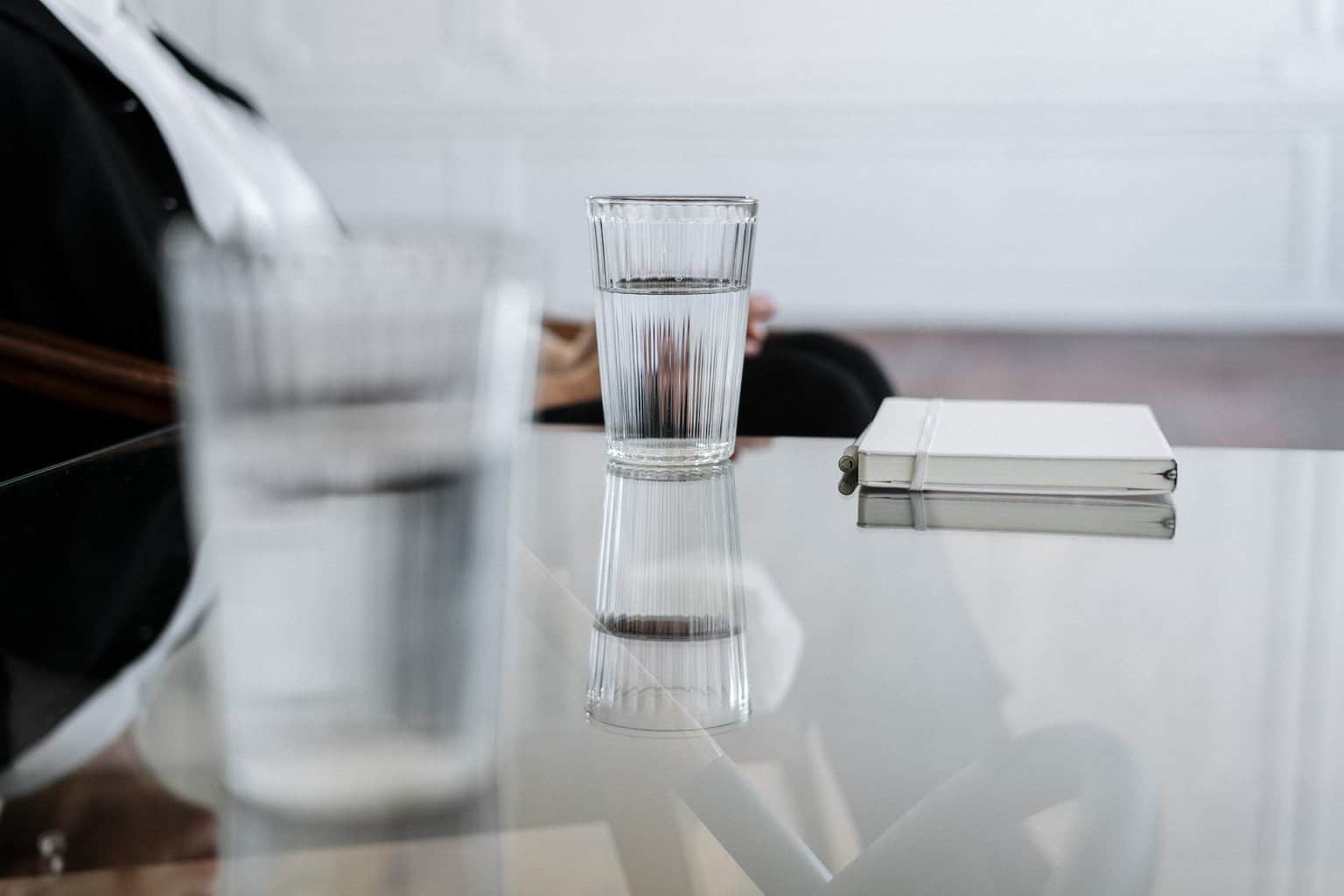 clear drinking glass on table - 4 Reasons Why You Should Switch Business Water Retailer