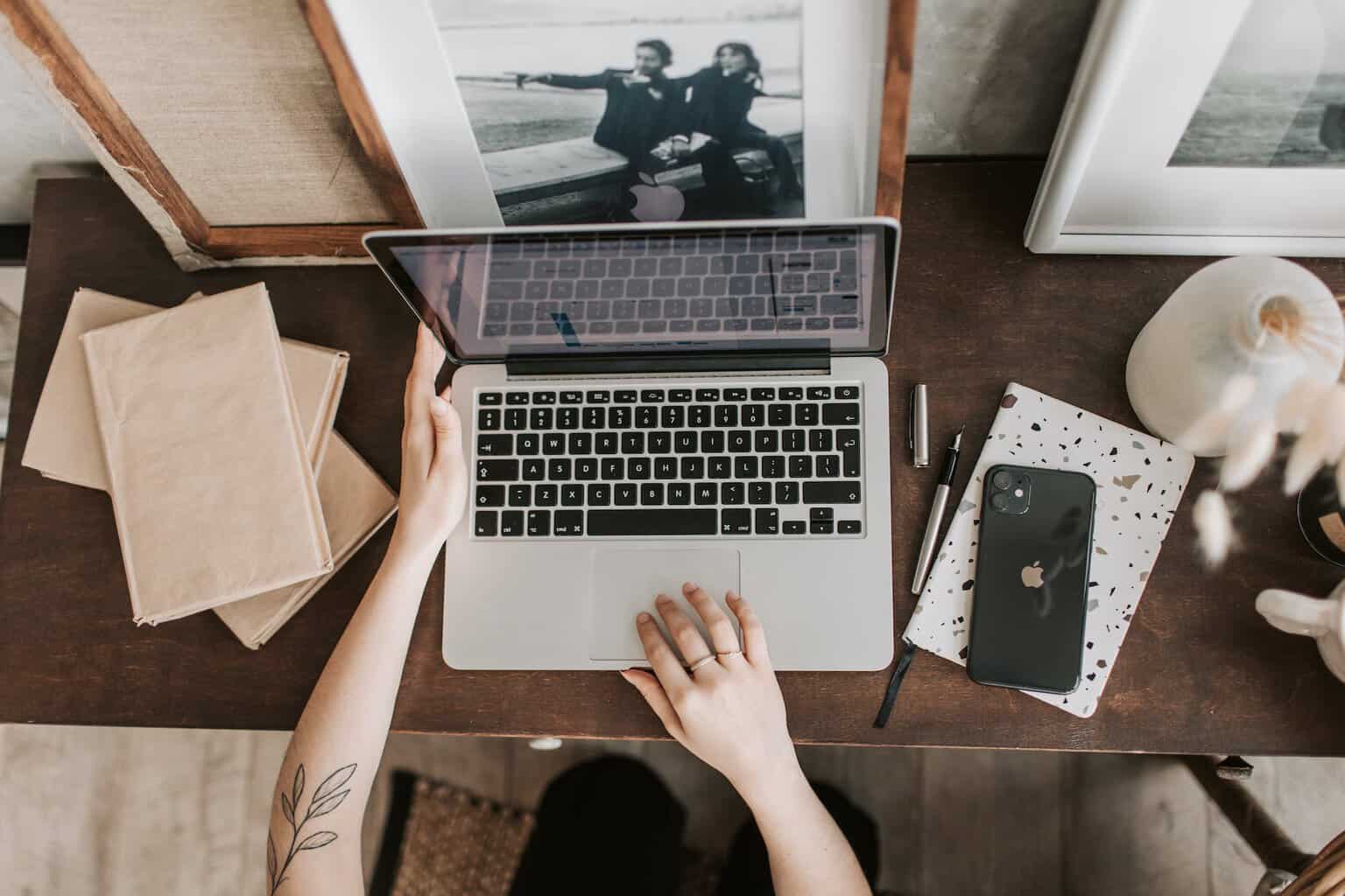 unrecognizable lady using laptop in workspace - Could A Digital Media Career Be Your Bag? The Options To Consider