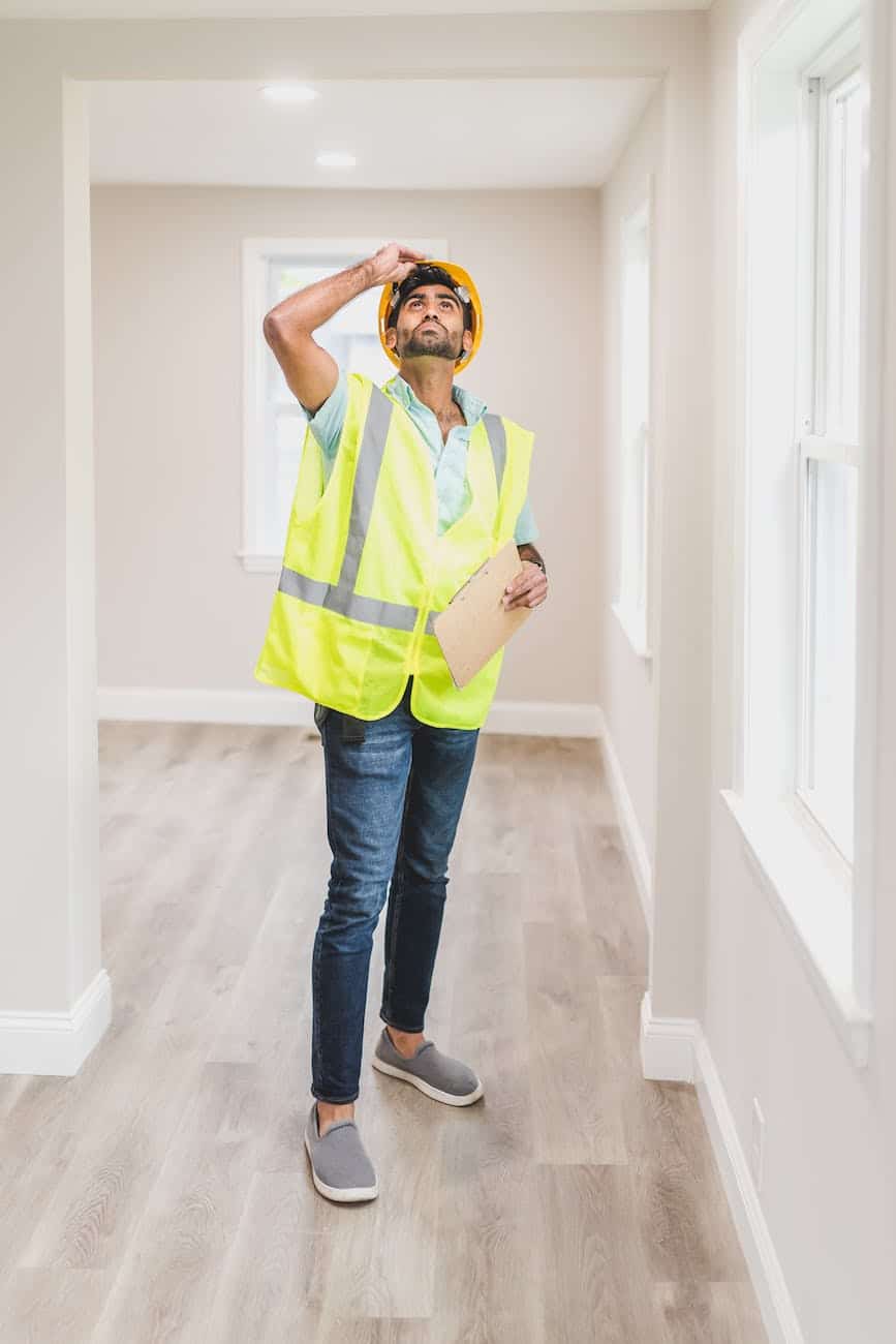 a man inspecting the house interior - 4 Things to Expect From Your New Home Inspection