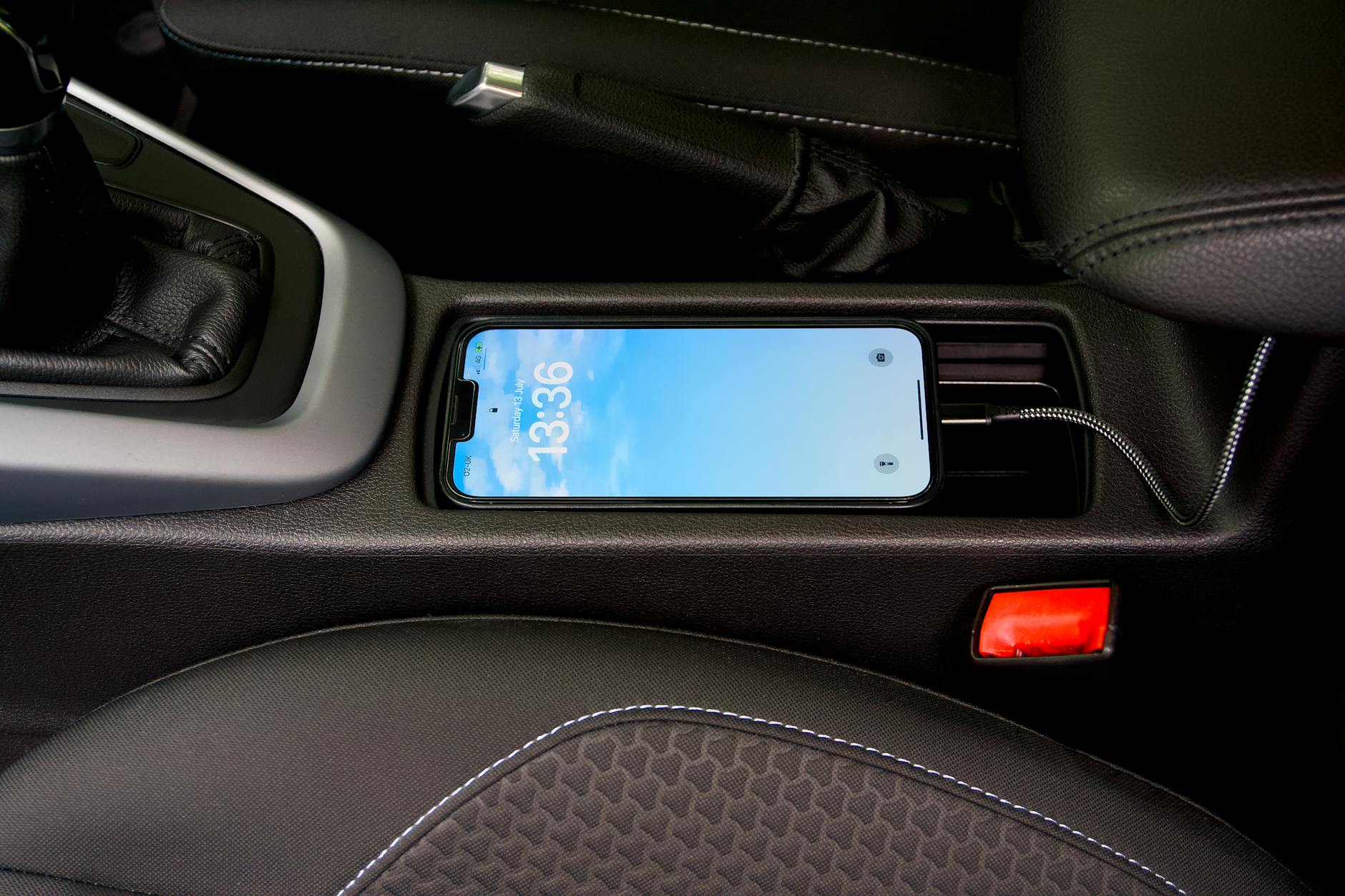 a smartphone charging in a car - How Automotive Brands Are Adapting to Lifestyle-Driven Buyers